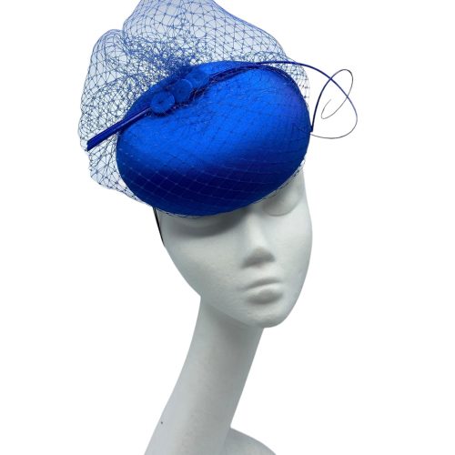 Stunning versatile blue headpiece with veiled base and matching blue quill detail.